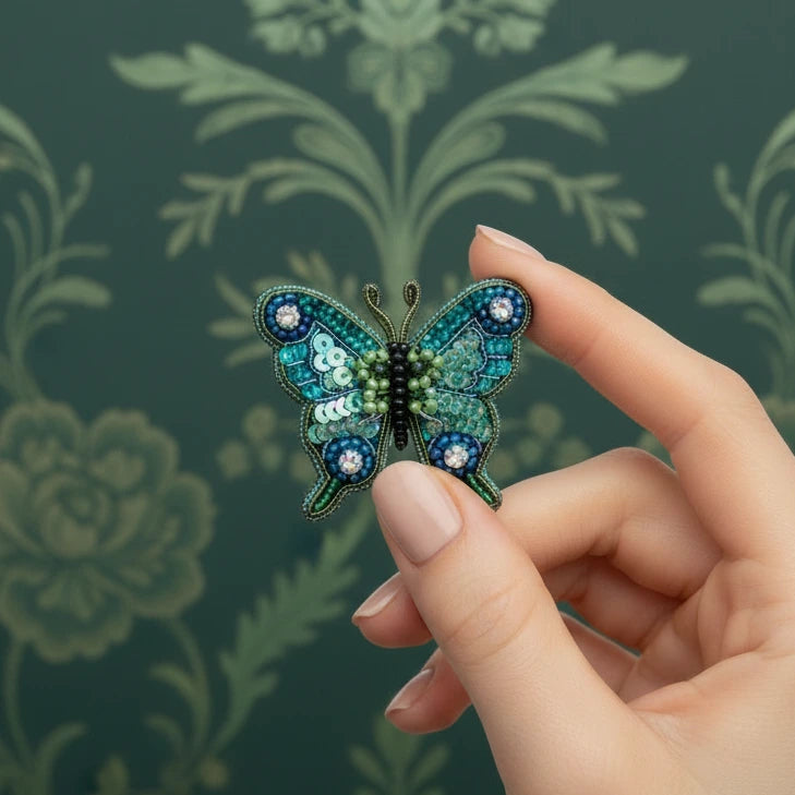 Decorative butterfly with blue and green patterns on a white background